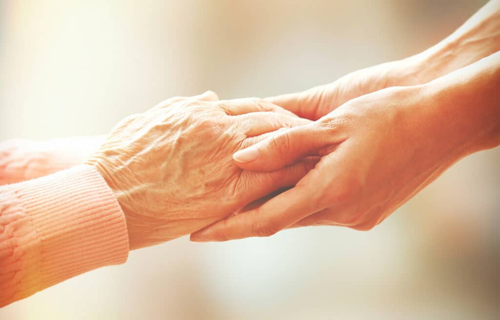 bigstock-Helping-hands-care-for-the-el-79012273